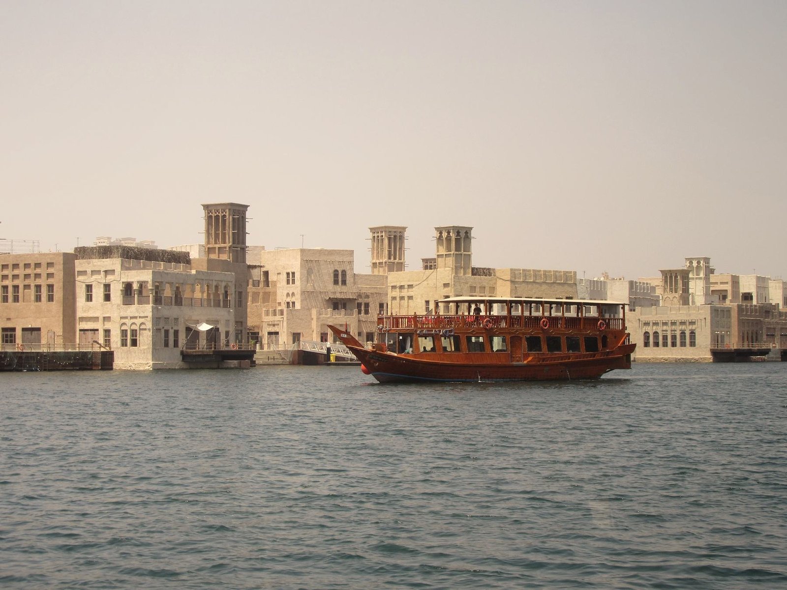 A wooden dhow passing Al Seef