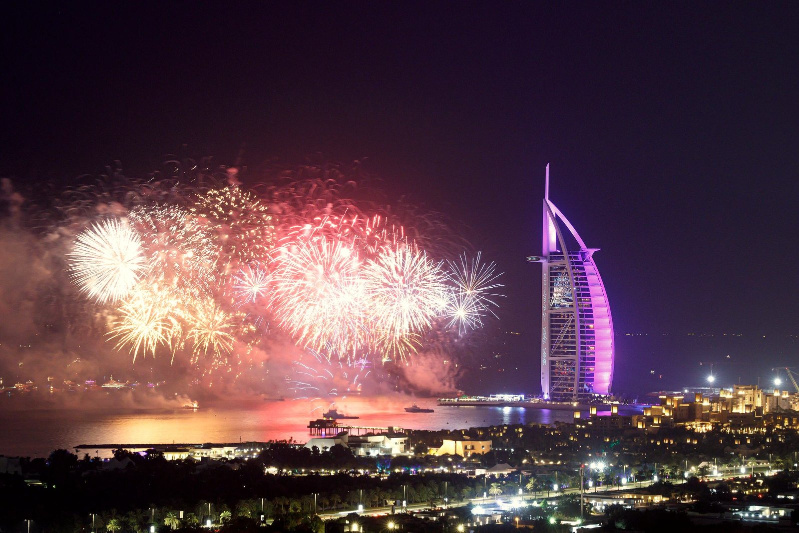 Fireworks lighting the sky beside Burj Al Arab