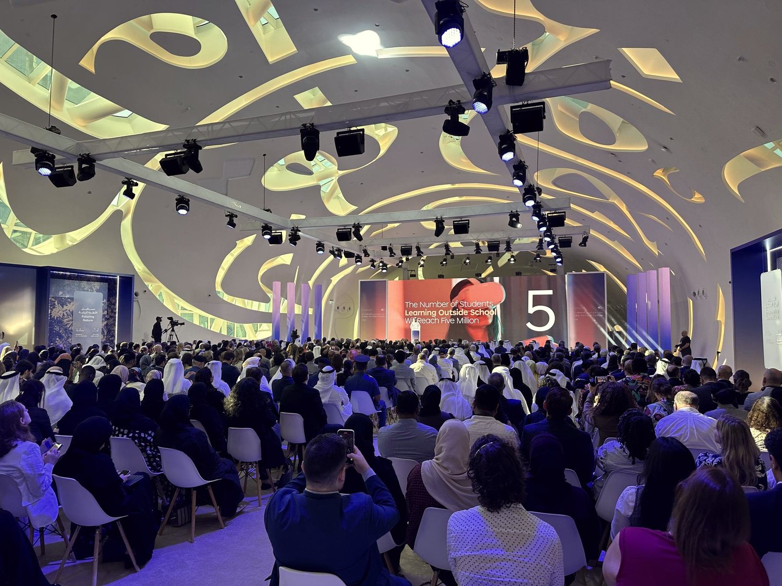 A full Dubai conference hall facing the stage